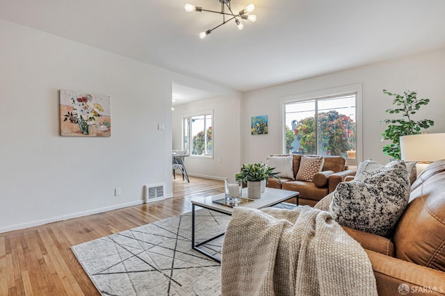 1567 44th Ave, San Francisco, CA 94122 - living area with a chandelier and light wood-type flooring