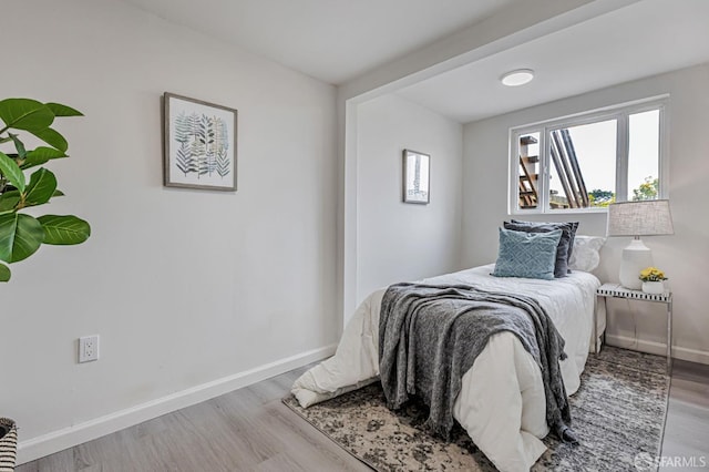 1567 44th Ave, San Francisco, CA 94122 - bedroom with baseboards and wood finished floors
