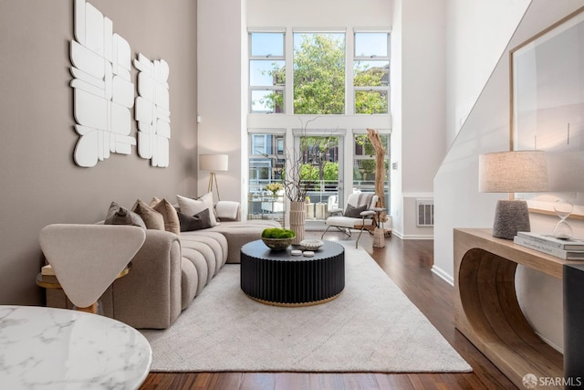 1970 Sutter St Unit 107, San Francisco, CA 94115 - living area with healthy amount of natural light, dark wood-style flooring, and a towering ceiling
