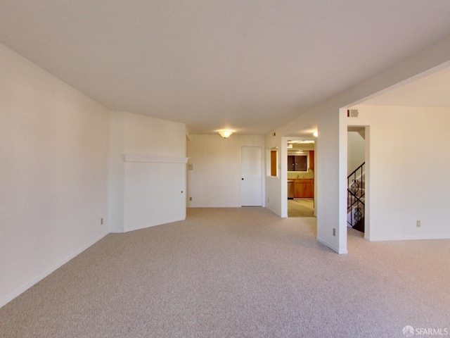 1279 41st Ave, San Francisco, CA 94122 - unfurnished room featuring light carpet and stairs