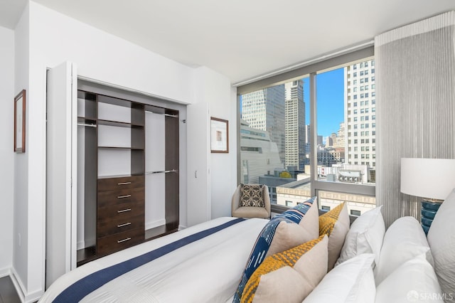 1 Hawthorne St Unit 12F, San Francisco, CA 94105 - bedroom featuring a city view, expansive windows, and a closet