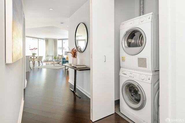 1 Hawthorne St Unit 12F, San Francisco, CA 94105 - laundry area featuring stacked washer / drying machine, dark wood-style flooring, and recessed lighting