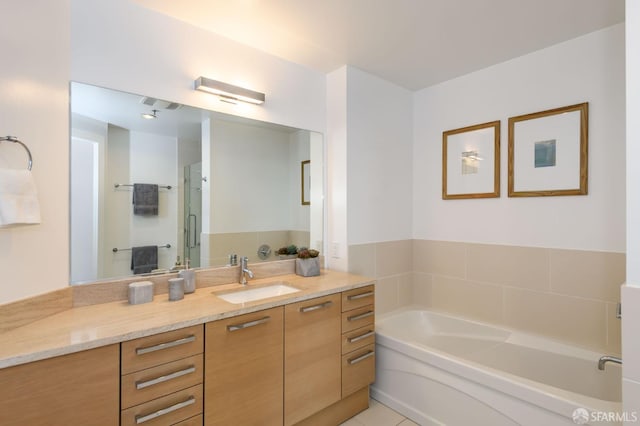 1 Hawthorne St Unit 12F, San Francisco, CA 94105 - bathroom with a garden tub, vanity, a shower stall, and tile patterned floors