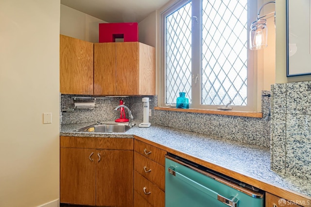 kitchen with dishwasher, sink, and decorative backsplash