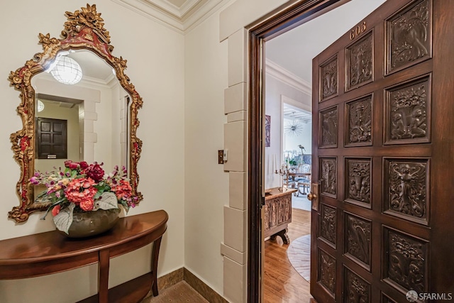 corridor featuring wood-type flooring and ornamental molding