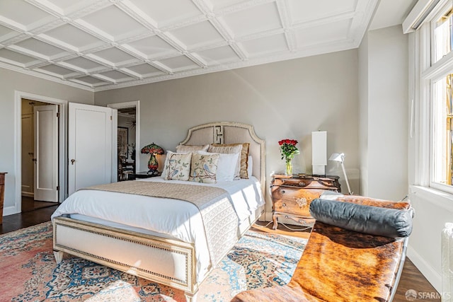 bedroom featuring coffered ceiling and dark hardwood / wood-style floors