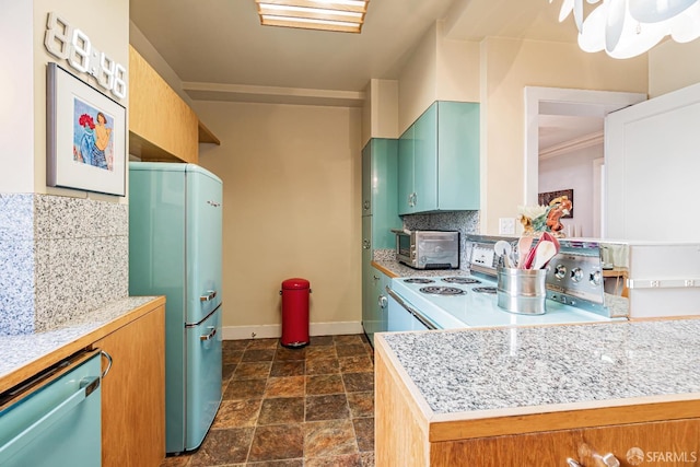 kitchen featuring decorative backsplash, kitchen peninsula, and appliances with stainless steel finishes