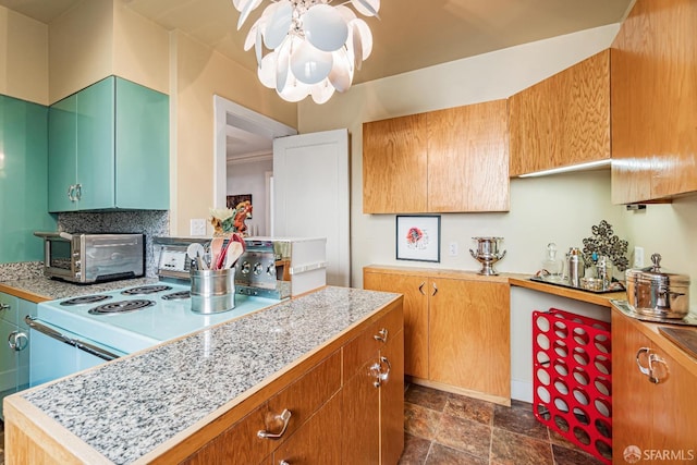 kitchen featuring stainless steel range with electric cooktop and ceiling fan