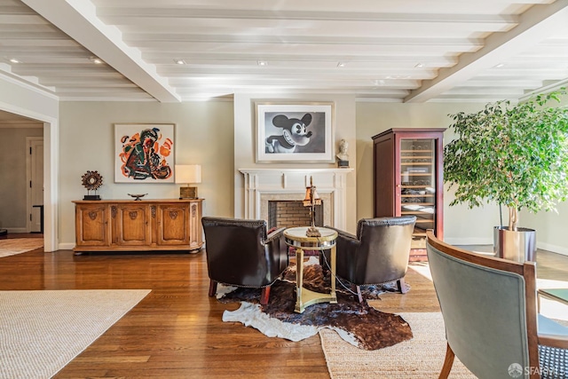 interior space with beamed ceiling, dark hardwood / wood-style floors, and crown molding