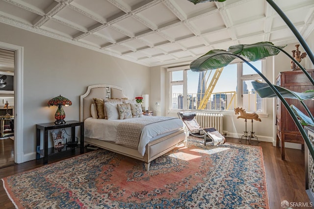 bedroom featuring beam ceiling, coffered ceiling, dark hardwood / wood-style floors, and radiator heating unit