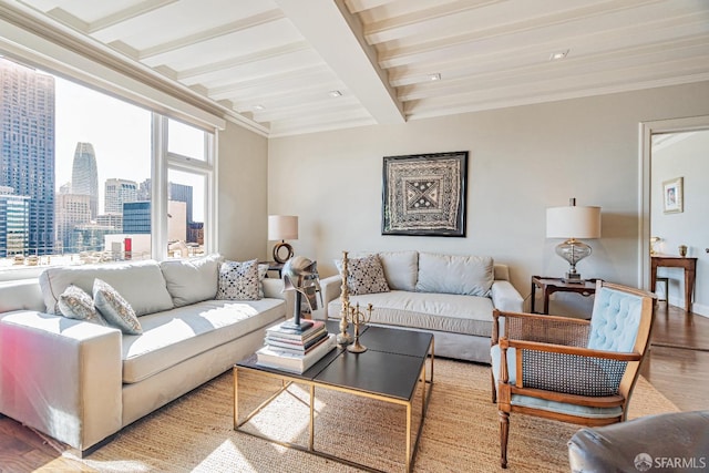 living room featuring light hardwood / wood-style floors, crown molding, and beam ceiling