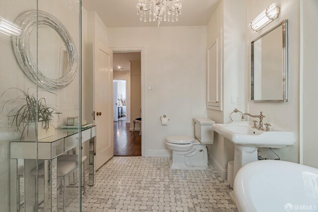 bathroom featuring wood-type flooring and toilet