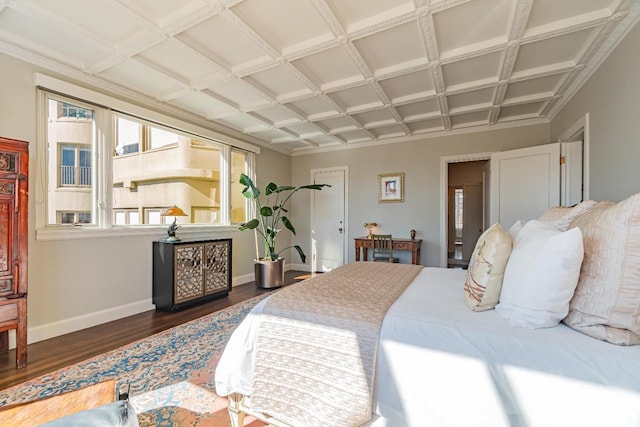 bedroom featuring coffered ceiling and dark hardwood / wood-style flooring