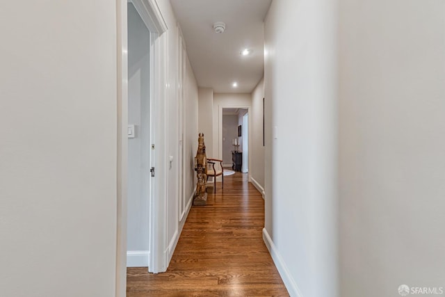 hall with hardwood / wood-style flooring