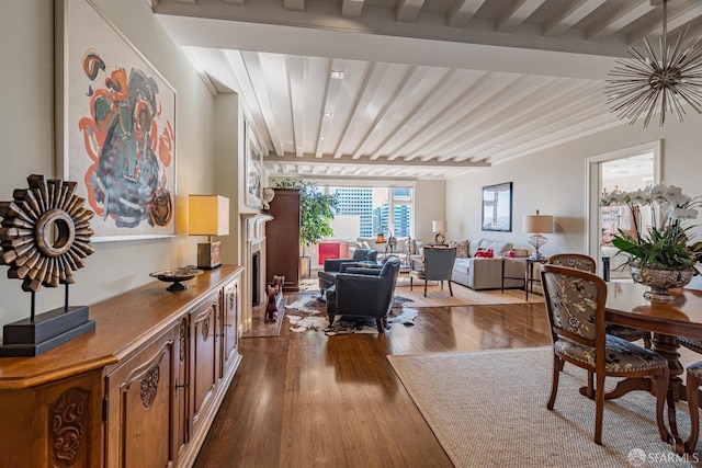 interior space with light hardwood / wood-style floors and beam ceiling