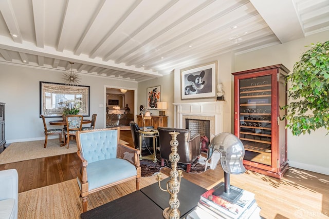 living room with beam ceiling and hardwood / wood-style flooring