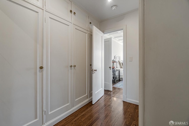 corridor with crown molding and dark hardwood / wood-style floors