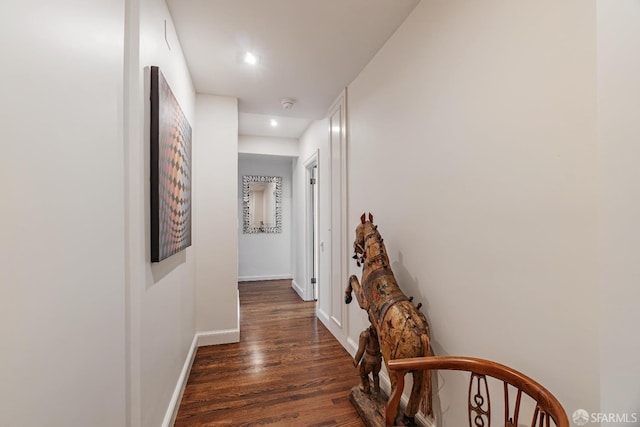 hall with dark hardwood / wood-style flooring