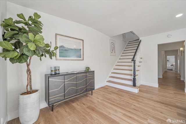 stairway with wood-type flooring