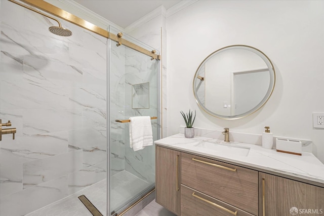 bathroom with vanity, crown molding, and a shower with shower door