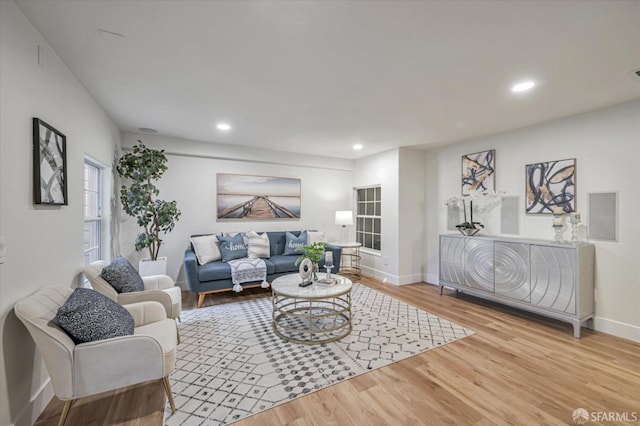 living room with light hardwood / wood-style flooring