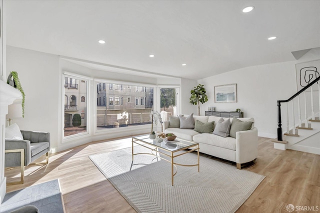 living room with light hardwood / wood-style flooring