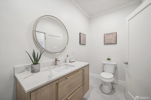 bathroom featuring vanity, crown molding, and toilet