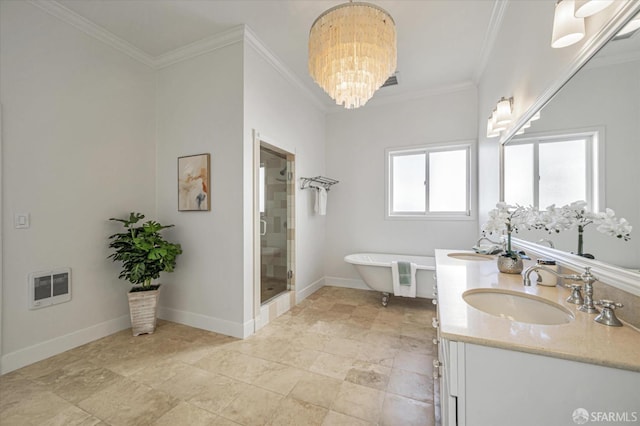 bathroom with an inviting chandelier, ornamental molding, shower with separate bathtub, and vanity