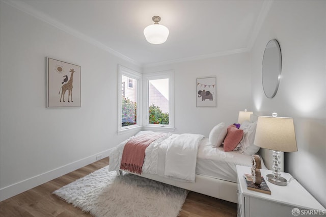 bedroom featuring ornamental molding and dark hardwood / wood-style floors