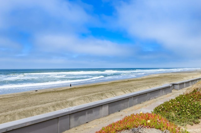 view of water feature with a beach view