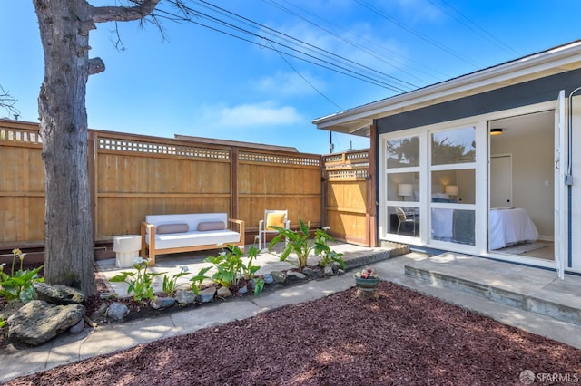 view of yard featuring a patio area and fence