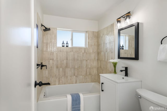 bathroom with vanity,  shower combination, and toilet