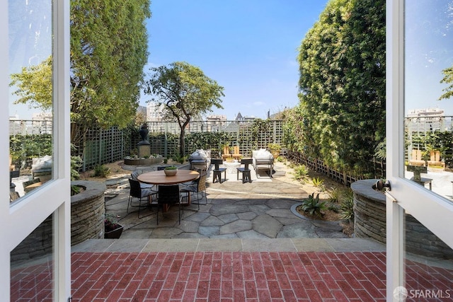 view of patio / terrace featuring outdoor dining area and a fenced backyard