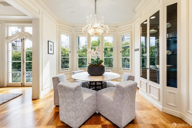 sunroom featuring an inviting chandelier