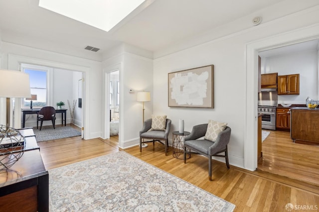 1015 Ashbury St Unit 4, San Francisco, CA 94117 - sitting room featuring light wood finished floors and a skylight