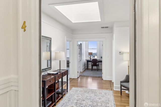 1015 Ashbury St Unit 4, San Francisco, CA 94117 - hallway featuring a skylight, an office area, and light wood-type flooring
