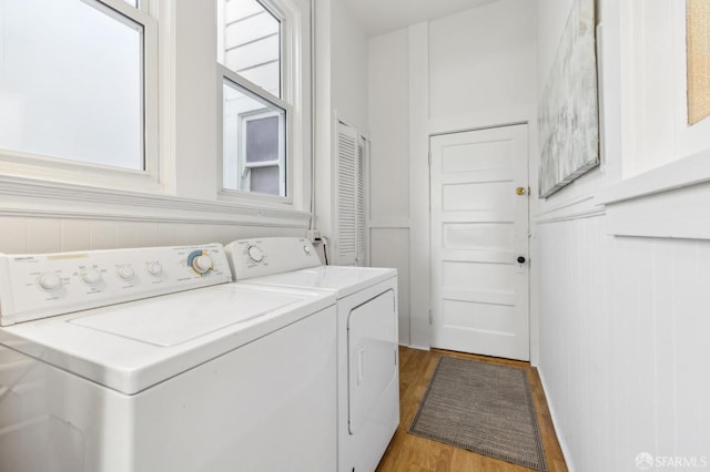 1015 Ashbury St Unit 4, San Francisco, CA 94117 - washroom with washer and clothes dryer and light wood-type flooring