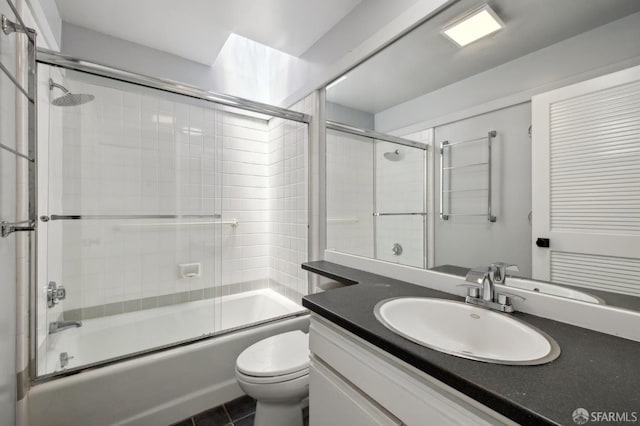 120 Landers St Unit D, San Francisco, CA 94114 - bathroom with toilet, vanity, bath / shower combo with glass door, and tile patterned flooring