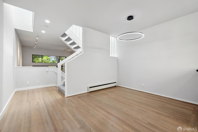 120 Landers St Unit D, San Francisco, CA 94114 - unfurnished living room with a baseboard radiator, stairway, wood finished floors, baseboards, and recessed lighting