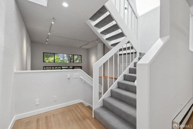 120 Landers St Unit D, San Francisco, CA 94114 - stairs with track lighting, wood finished floors, baseboards, and recessed lighting
