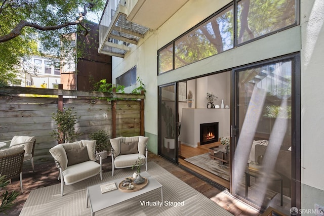 120 Landers St Unit D, San Francisco, CA 94114 - view of patio / terrace with a deck and an outdoor living space with a fireplace