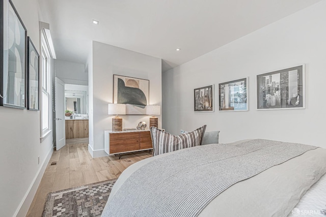 bedroom with visible vents, recessed lighting, wood finished floors, and baseboards