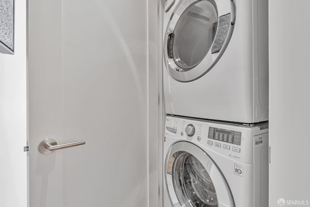 laundry area with laundry area and stacked washer and clothes dryer