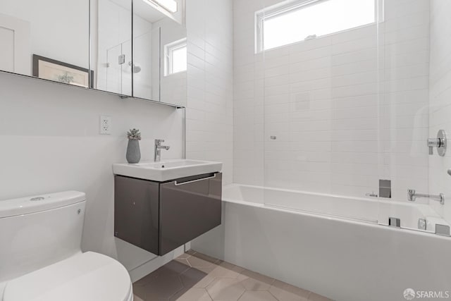 bathroom with vanity, tile patterned floors, toilet, and shower / bathing tub combination