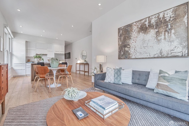 living area with recessed lighting and light wood-type flooring