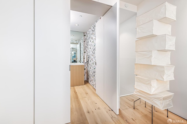 38 Bryant St Unit 405, San Francisco, CA 94105 - bathroom featuring wood finished floors and vanity