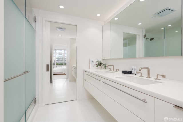 38 Bryant St Unit 405, San Francisco, CA 94105 - full bathroom featuring ensuite bathroom, double vanity, a shower with door, and recessed lighting