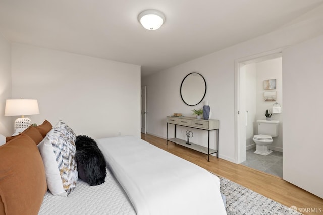 1727 45th Ave, San Francisco, CA 94122 - bedroom featuring wood finished floors and connected bathroom