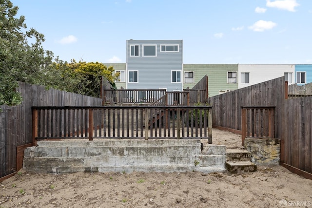 1727 45th Ave, San Francisco, CA 94122 - rear view of property with a fenced backyard and a wooden deck