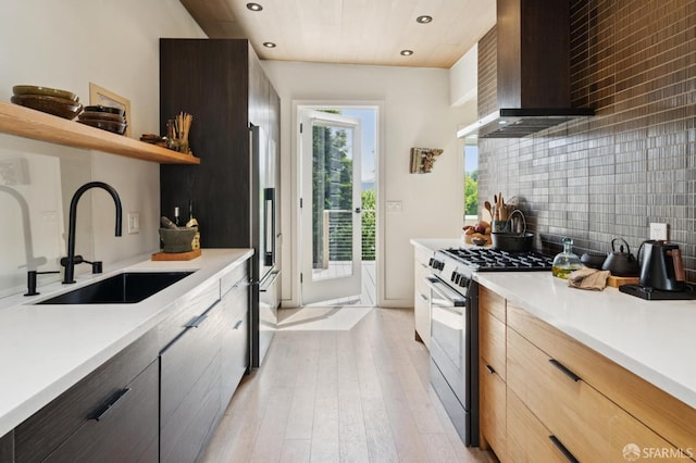 1515 Van Dyke Ave, San Francisco, CA 94124 - kitchen featuring wall chimney exhaust hood, stainless steel range with gas stovetop, open shelves, recessed lighting, and modern cabinets